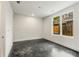 Neutral bedroom with large window, and dark floors at 241 Maynard Se Ter # 15, Atlanta, GA 30316