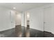 Neutral bedroom with multiple white doors, and dark floors at 241 Maynard Se Ter # 15, Atlanta, GA 30316