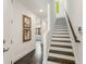 Entryway view of white walls, staircase with wood handrail, and dark wood flooring at 241 Maynard Se Ter # 15, Atlanta, GA 30316