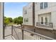 Balcony view of the building's exterior, showcasing the modern architecture, garages, and street at 241 Maynard Se Ter # 15, Atlanta, GA 30316