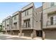 Exterior view of modern townhomes with brick accents and garages at 241 Maynard Se Ter # 15, Atlanta, GA 30316