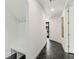 Bright hallway with coat rack and bench, and dark floors at 241 Maynard Se Ter # 15, Atlanta, GA 30316