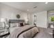 Comfortable main bedroom featuring soft carpet, neutral walls, and decorative pillows at 241 Maynard Se Ter # 15, Atlanta, GA 30316