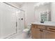 Bathroom featuring a glass door shower, a vanity with storage, and neutral walls at 2719 Byess Ct, Marietta, GA 30064