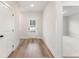 Bright entryway featuring wood-look flooring, white walls, and a glass-paneled front door to the outside at 2719 Byess Ct, Marietta, GA 30064