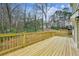 Expansive wooden deck overlooking the landscaped backyard and lush trees at 3158 Stonegate Sw Dr, Atlanta, GA 30331