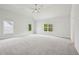 Bright main bedroom with vaulted ceilings, carpeted floors, and large windows at 3158 Stonegate Sw Dr, Atlanta, GA 30331