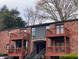 Charming brick building with multiple levels and private balconies, offering a cozy and inviting living space at 323 Ne 8Th Ne St, Atlanta, GA 30309