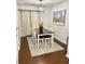 Charming dining area with a wood table, chairs, and stylish decor on hardwood floors at 3571 Parc Sw Cir, Atlanta, GA 30311