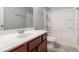 Bathroom featuring a single sink vanity, white countertop, and bathtub with shower at 4525 Hopewell Manor Dr, Cumming, GA 30028