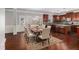 Dining area with wood floors and large windows providing ample natural light at 4525 Hopewell Manor Dr, Cumming, GA 30028