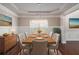 Elegant dining room with wood floors, a chandelier, and tasteful decor and neutral paint at 4525 Hopewell Manor Dr, Cumming, GA 30028