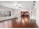 Bright, open living space with wood floors, modern paint, and seamless flow into the kitchen area at 4525 Hopewell Manor Dr, Cumming, GA 30028