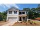 New construction exterior elevation featuring white siding and brick accents at 2 Loth Wages (Lot 2) Rd, Dacula, GA 30019