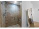 Elegant glass shower featuring a built-in seat and tiled walls at 270 17Th Nw St # 2601, Atlanta, GA 30363