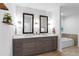 Luxurious bathroom with double sinks, vanity, tub, and tile flooring at 270 17Th Nw St # 2601, Atlanta, GA 30363