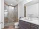 Modern bathroom featuring a tiled glass shower, sleek vanity, and ample lighting at 270 17Th Nw St # 2601, Atlanta, GA 30363