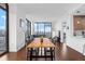 Open dining area with hardwood floors and city skyline views at 270 17Th Nw St # 2601, Atlanta, GA 30363