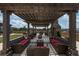 Comfortable outdoor seating area under a wooden pergola with city views at 270 17Th Nw St # 2601, Atlanta, GA 30363