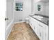 Bathroom featuring modern vanity, neutral walls and flooring at 4679 Bartlett Rd, Forest Park, GA 30297