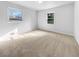 Sun-filled bedroom featuring plush carpet, neutral paint, and bright windows at 4679 Bartlett Rd, Forest Park, GA 30297