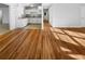 Bright living room with hardwood flooring leads into the kitchen area at 4679 Bartlett Rd, Forest Park, GA 30297