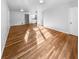 Bright living room featuring hardwood floors and neutral paint, filled with natural light at 4679 Bartlett Rd, Forest Park, GA 30297