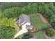 Aerial view of the home displays the well-manicured lawn and surrounding mature trees at 765 Hembree Rd, Alpharetta, GA 30076