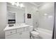Bathroom with a white vanity, tiled shower, and a view into an adjacent bedroom at 765 Hembree Rd, Alpharetta, GA 30076