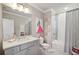 Stylish bathroom featuring a tub-shower combo, vanity with a white countertop, and a modern, fashionable design at 765 Hembree Rd, Alpharetta, GA 30076