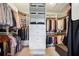 Spacious walk-in closet with custom shelving, hanging rods, and built in drawers for maximum storage at 765 Hembree Rd, Alpharetta, GA 30076
