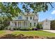 Charming two-story home with a inviting front porch and meticulously landscaped yard at 765 Hembree Rd, Alpharetta, GA 30076
