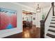 Grand foyer showcasing staircase, hardwood floors, and elegant dining room in background at 765 Hembree Rd, Alpharetta, GA 30076