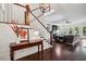Elegant foyer with staircase, hardwood floors, and an open view to the living room at 765 Hembree Rd, Alpharetta, GA 30076
