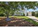 Stunning two-story white farmhouse with a swing on a tree and lush green lawn at 765 Hembree Rd, Alpharetta, GA 30076