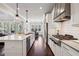 Spacious kitchen with a large island, stainless steel appliances, and hardwood flooring at 765 Hembree Rd, Alpharetta, GA 30076