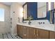 Modern bathroom with double vanity, marble countertop and decorative floor tiles at 28 Peachtree Hills Ne Ave, Atlanta, GA 30305