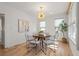 Sunlit dining room with modern light fixture and hardwood flooring at 28 Peachtree Hills Ne Ave, Atlanta, GA 30305