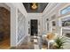 Elegant foyer featuring stone floors, designer wallpaper, and abundant natural light at 28 Peachtree Hills Ne Ave, Atlanta, GA 30305