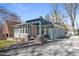 Charming blue brick home with a stylish pergola entrance and a cozy seating area at 28 Peachtree Hills Ne Ave, Atlanta, GA 30305