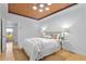 Bright main bedroom with hardwood floors, tray ceiling and stylish decor at 28 Peachtree Hills Ne Ave, Atlanta, GA 30305