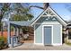 Stylist outbuilding with covered patio, creating an inviting outdoor seating area for entertaining and relaxing at 28 Peachtree Hills Ne Ave, Atlanta, GA 30305