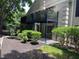 View of the townhome patio with shade trees and a view of a two-story apartment at 3527 Essex Ave # 74, Atlanta, GA 30339