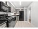 Modern kitchen with stainless steel oven, granite countertops, and tile floors at 3527 Essex Ave # 74, Atlanta, GA 30339