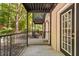 Exterior patio with black railings, concrete flooring and covered ceiling, offering outdoor living space at 3527 Essex Ave # 74, Atlanta, GA 30339