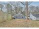 View of backyard with a wooden fence and the back of the house with neutral exterior and windows at 403 Westchester Nw Blvd, Atlanta, GA 30314