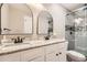 Bathroom featuring double vanity with stone countertop, modern fixtures, and glass-enclosed shower at 403 Westchester Nw Blvd, Atlanta, GA 30314