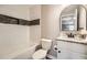 Bathroom featuring white subway tile, decorative accent tiles, granite vanity, and updated fixtures at 403 Westchester Nw Blvd, Atlanta, GA 30314