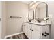 Bathroom featuring dual sinks, granite counters and modern fixtures at 403 Westchester Nw Blvd, Atlanta, GA 30314