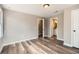 Bedroom with neutral paint, wood-look floors, and ensuite bathroom access at 403 Westchester Nw Blvd, Atlanta, GA 30314